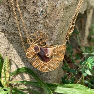 Mookite hand wire wrapped in gold plated copper wire.